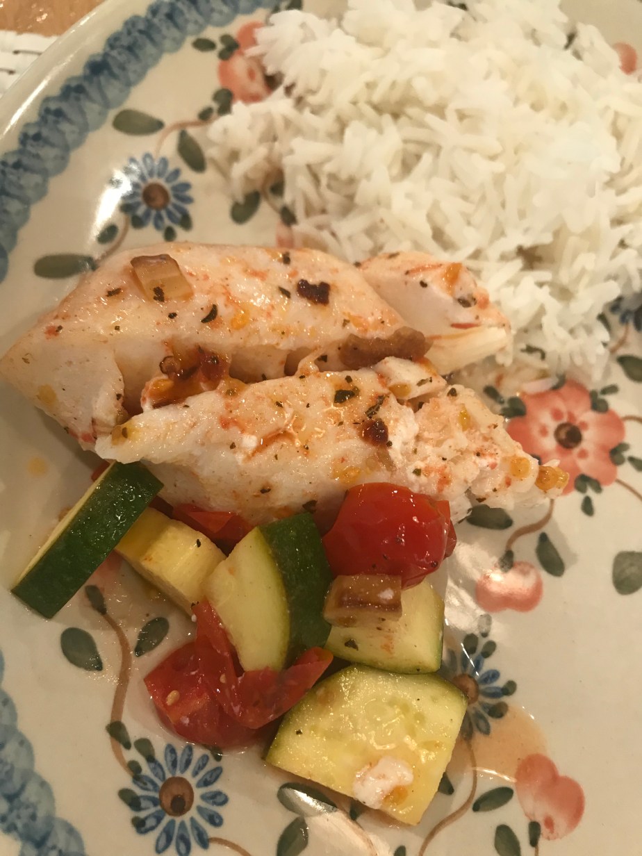 Baked cod with sauteed tomatoes garlic and&nbsp;zucchini